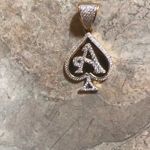Gold overlay ace of spade emblem with chain